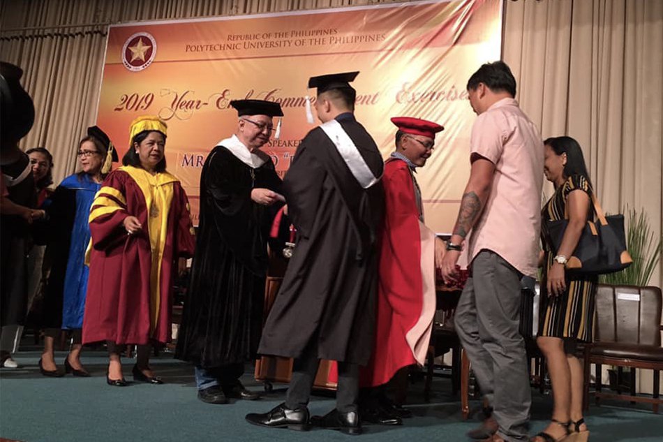 Ricky Lee receiving diploma