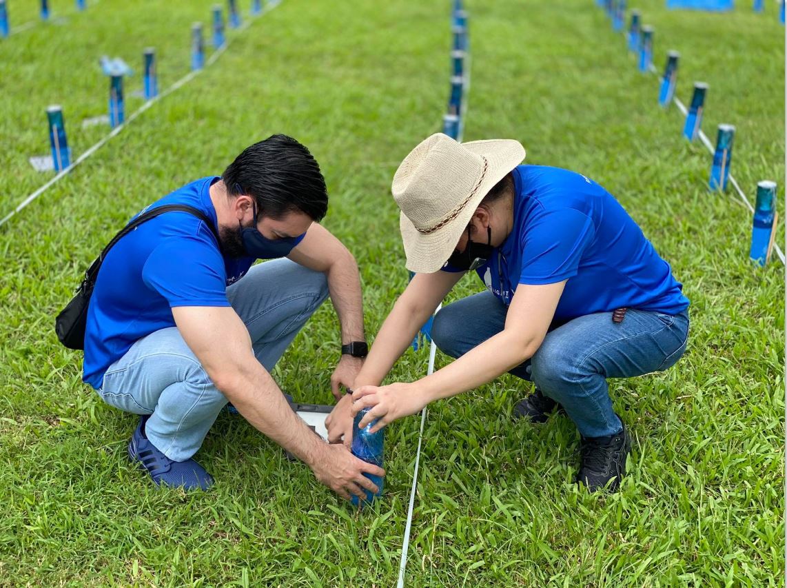 The team sets up the solar lamps to form the Philippine flag.